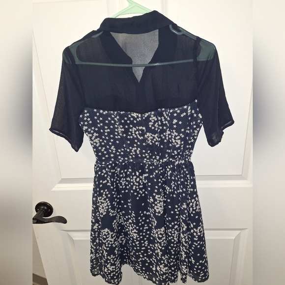 A Vera Wang Princess Star Navy dress with a sheer collar in a girl's size 5. - Picture 3 of 5